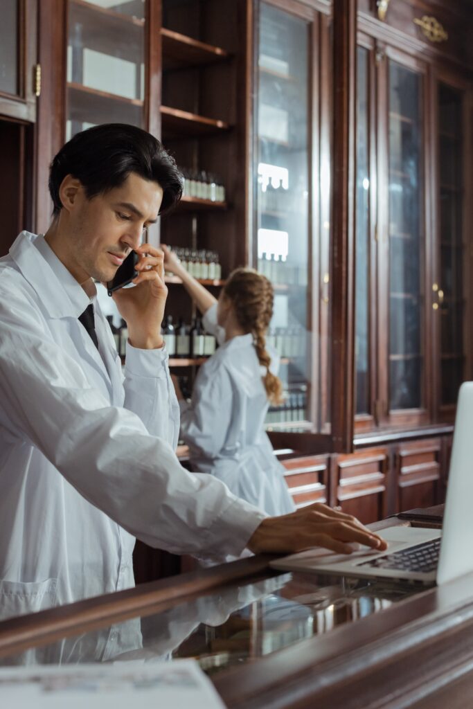 A Man in White Coat Talking on the Phone